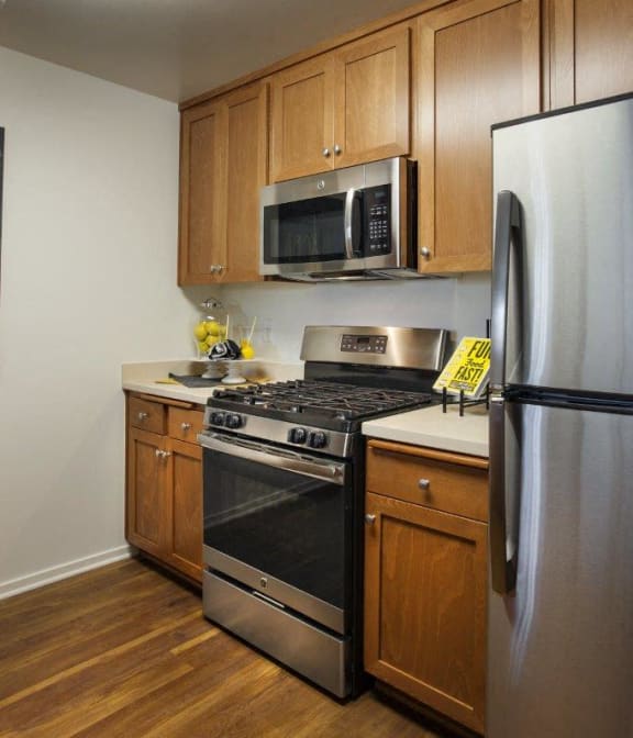 Updated Kitchen With Black Appliances at Hancock Terrace Apartments, Santa Maria, California