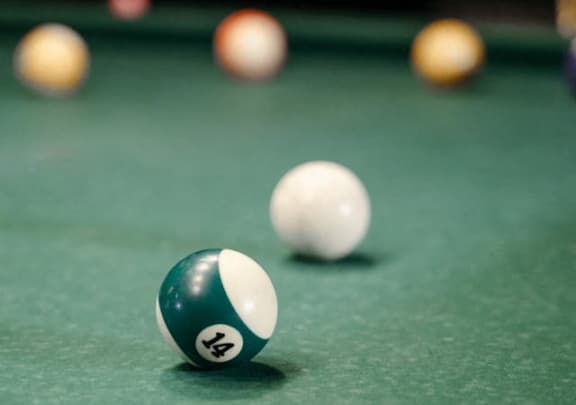 a billiard ball on a pool table