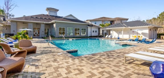 The Avenues at Verdier Pointe Apartments Pool Area and Lounge Chairs