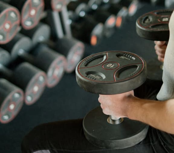 a man lifting weights in a gym