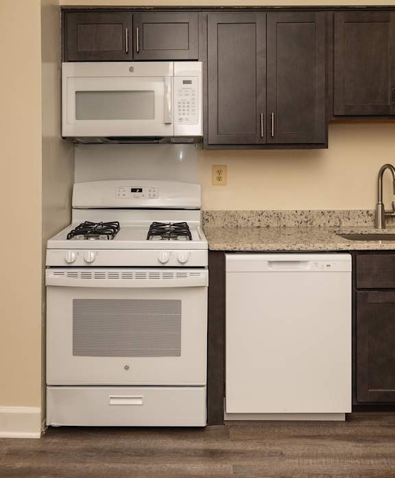 A kitchen with a white oven and a white dishwasher at Lawyers Hill Apartments, Elkridge, MD, 21075