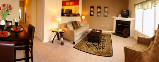 a living room filled with furniture and a fire place at Chester Village Green Apartments, Chester, 23831