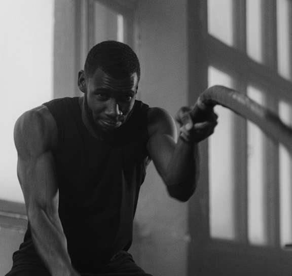 A man is working out in a gym.
