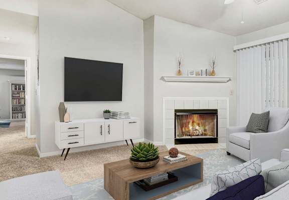 the estates at tanglewood|living room with fireplace and television