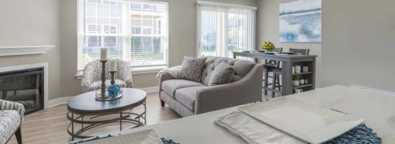 a living room with a couch and a bed