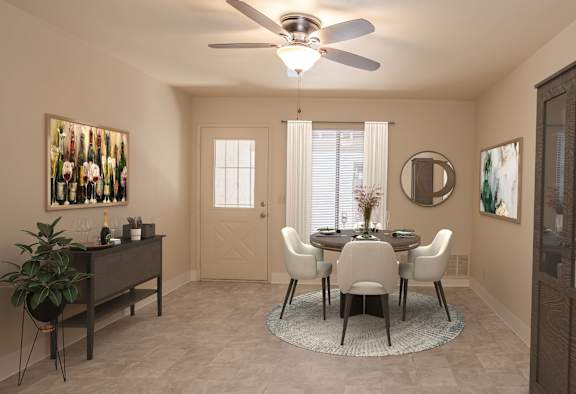 a dining room with a ceiling fan and a table and chairs at Castle Vista Senior Duplex Community, Atwater, California