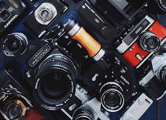 A collection of various vintage cameras.