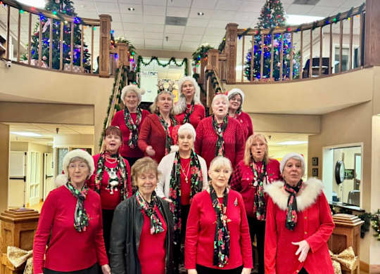 A group of people posing for a photo at River Commons Senior Living, Redding, California