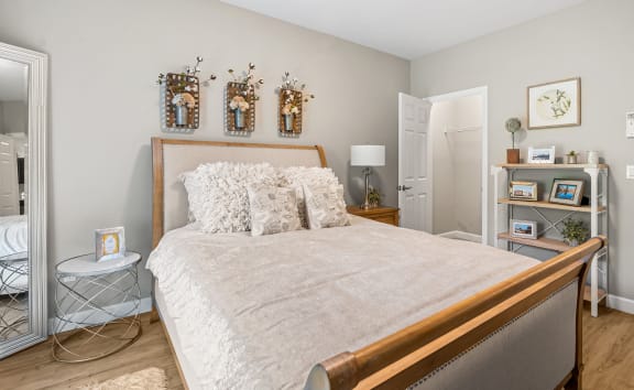 a bedroom with a large bed and a mirror at Lofts at 335, Stratford, Connecticut