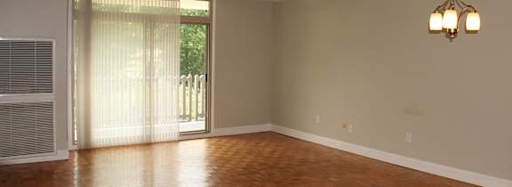 an empty living room with wood floors at Renew Worcester, Worcester, MA, 01602