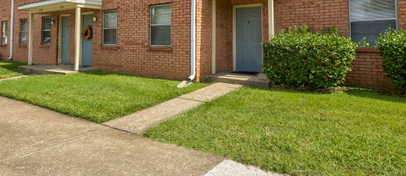a house with a walkway in front of it