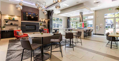 Koi Apartments in Ballard, Washington Clubhouse Lounge with Fireplace and Kitchen at Koi Apartments, Seattle, Washington