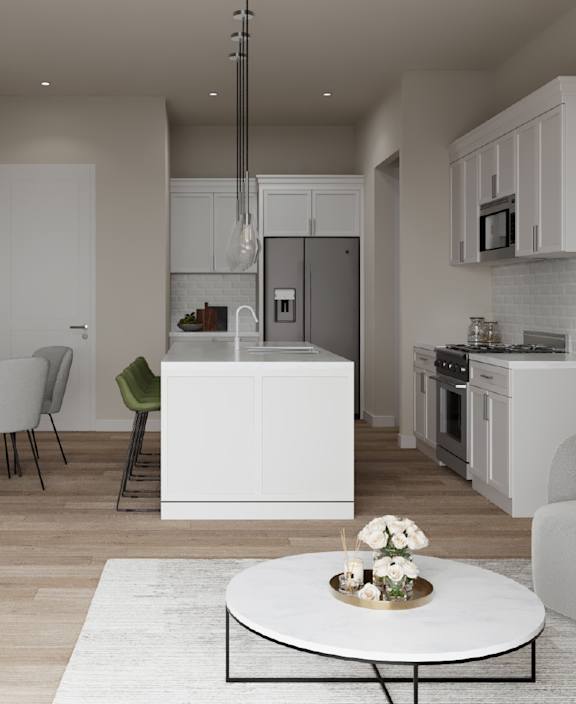 A modern kitchen with white cabinets and a black island.