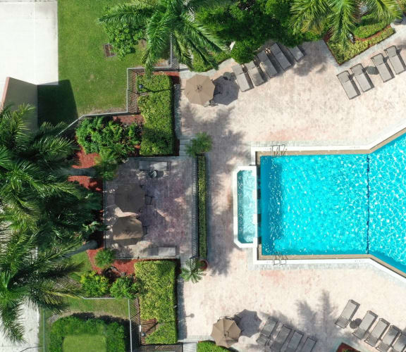 Overivew drone shot of pool area and sun deck