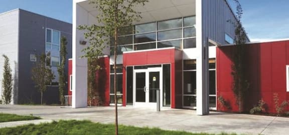 a photo of a building with red doors