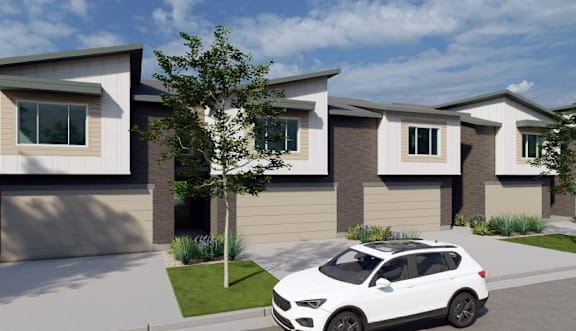 A white car is parked in front of a modern house.