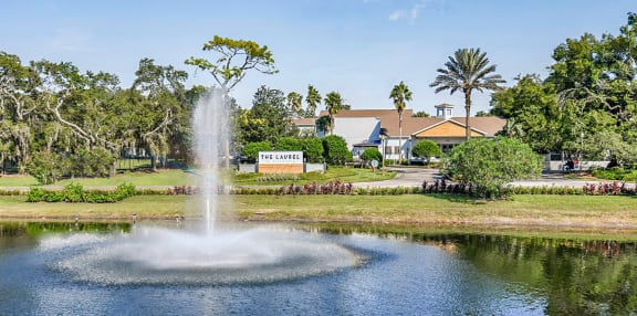fountain in the middle of the pond at the resort
