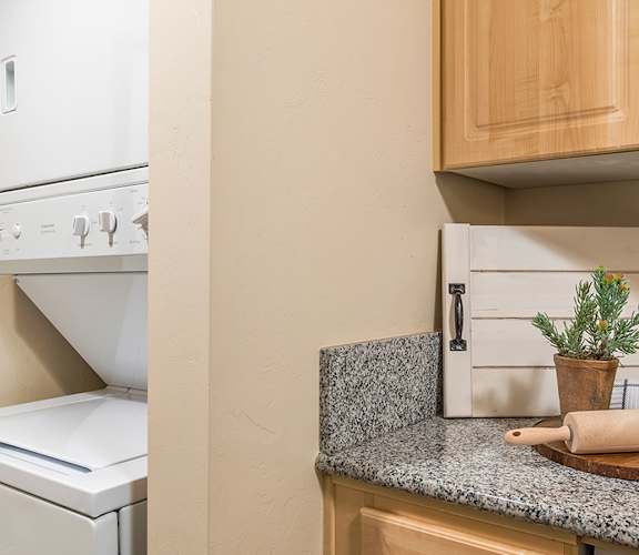 El Dorado Place laundry room with standard washer and dryer.