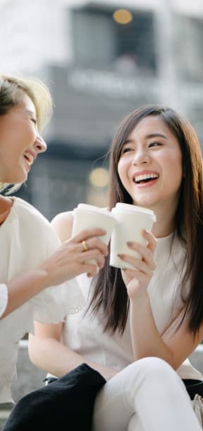 Women Laughing Enjoying a Cup of Coffee at Carrington Apartments in Fremont, CA 94538