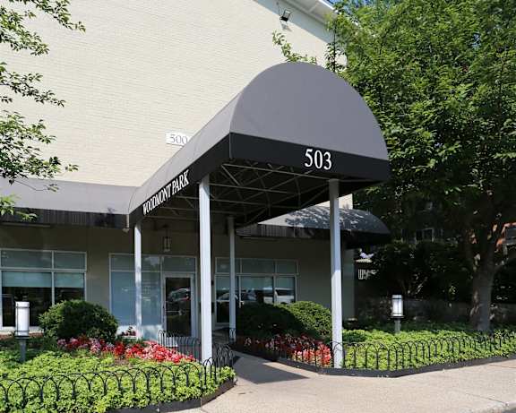 The front of a building with a black awning and the number 503 on it.