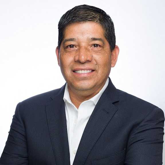 a man in a suit with his arms crossed