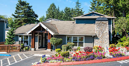 Pembrooke Apartments in Kent, Washington, Leasing office building landscaped with flowers 