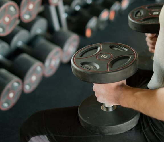 a man lifting weights in a gym