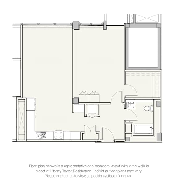 A floor plan of a one-bedroom apartment with a large walk-in closet at Liberty Tower Residences.