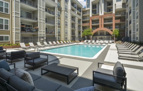 a swimming pool in front of an apartment building at The Citizen at Shirlington Village, Arlington