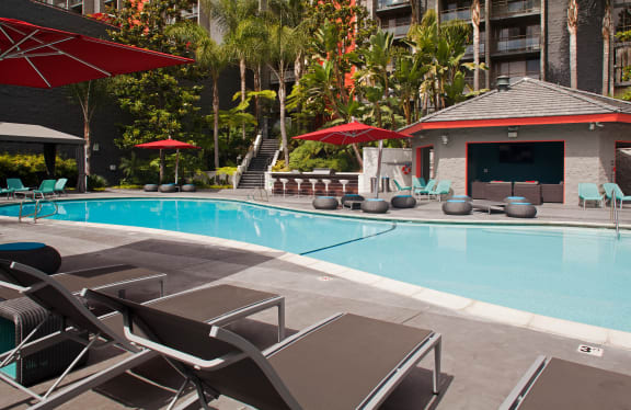 Apartments in San Diego CA - Resort Style Sparkling Pool at Lit on Cortez Hill Featuring Bar, Sundeck Lounge, and Various Pool Furniture