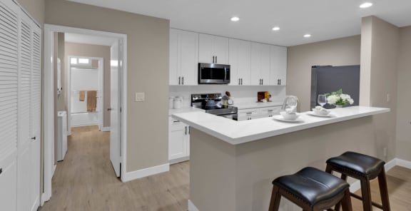 a kitchen with an island and two stools