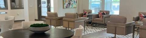 A Room With a Round Table and Celling Fan at Arbours at Quincy, Quincy