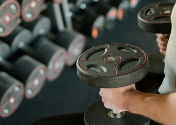 a man lifting weights in a gym