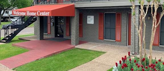 a building with a red awning in front of it