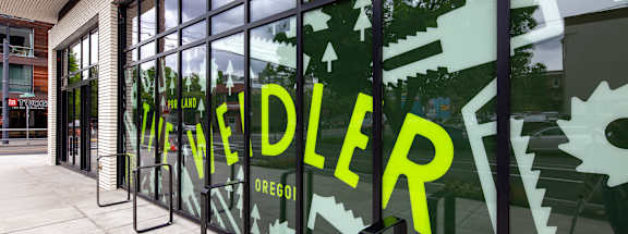 A glass wall with the word "WEDLER" written on it.
