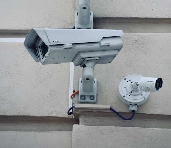 A security camera system is mounted on a building.