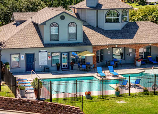 A house with a pool in the backyard at Clear Creek Meadows Apartments, Texas, 76522