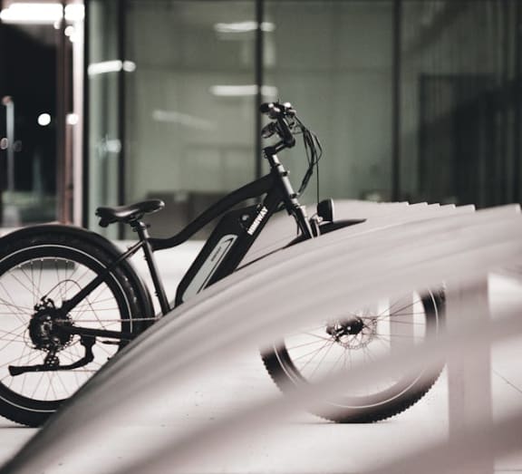 a bike parked on the side of a building