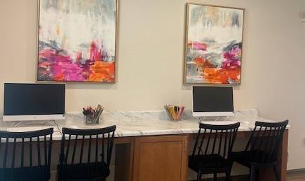 A Room With a Desk and Paintings on Wall at Arbours at Quincy, Quincy, Florida
