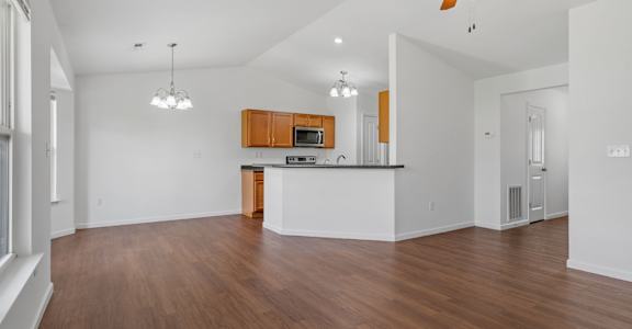 Spacious Living Area With Wood-Style Flooring