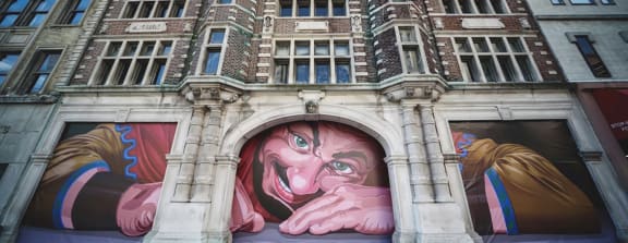 A mural of a giant at Art Lofts at Dayton Arcade in Dayton, OH