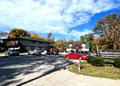 Thumbnail 11 of 19 - a view of the parking lot and entrance to vaughnheim apartments