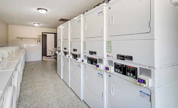 a row of white utility machines in a room
