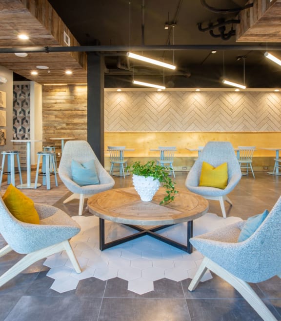 a living room with chairs and tables and a fireplace at 511 Meeting, Charleston, South Carolina