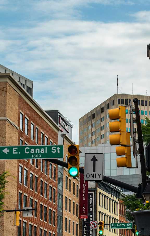 A street view with a traffic light showing green.