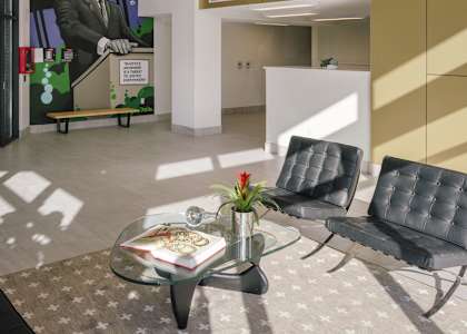 A room with a glass table and two chairs.
