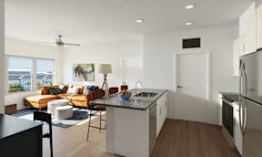 A modern kitchen with a refrigerator, sink, and stove.