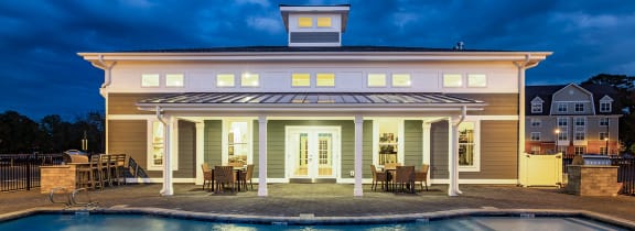 a pool in front of a building with a pool at Westport Apartments, Norfolk, VA 23505