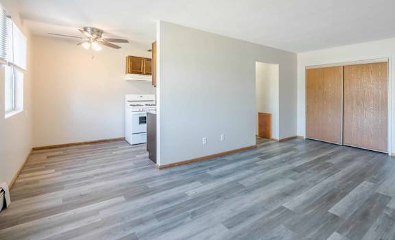 A spacious room with a washer and dryer in it.