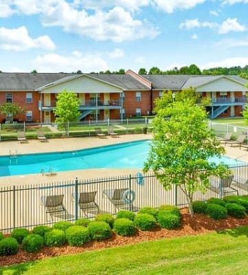 Open Green Space and Resort-Style Pool at Regal Pointe Apartments in Tuscaloosa, AL